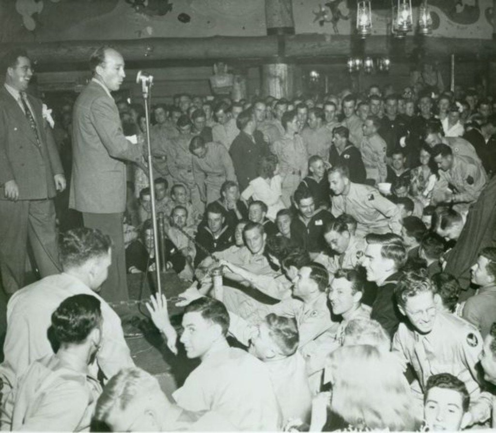 Bing Crosby, backed by John Scott Trotter, at the Hollywood Canteen in 1944. From Bing...
