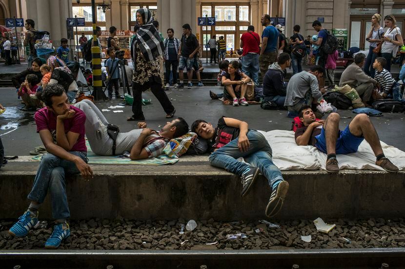 Migrants crowd a platform as they wait for trains at Keleti station in Budapest, Hungary,...