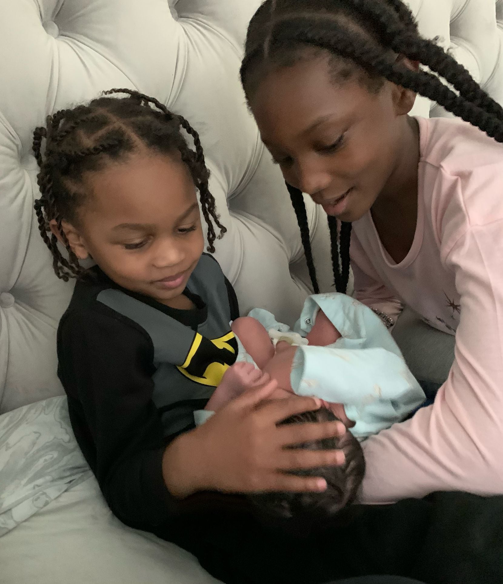 Dorian Finney-Smith's children Sinai, 11, and Dorian Jr., 4, hold their new baby brother...
