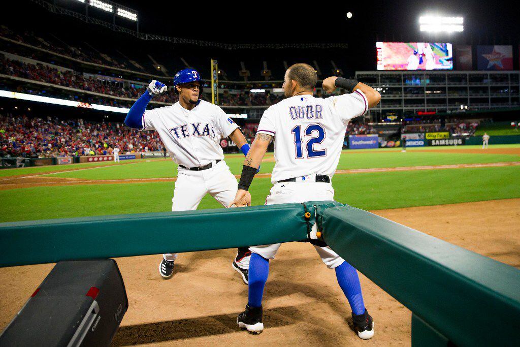 Texas Rangers left fielder Carlos Gomez celebrates with second baseman Rougned Odor after...