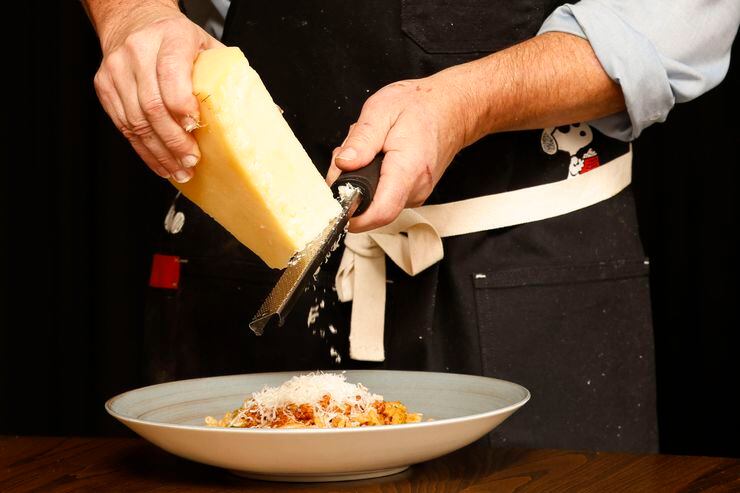 Chef John Tesar garnishes pasta at Knife Italian, his new restaurant opening at the...