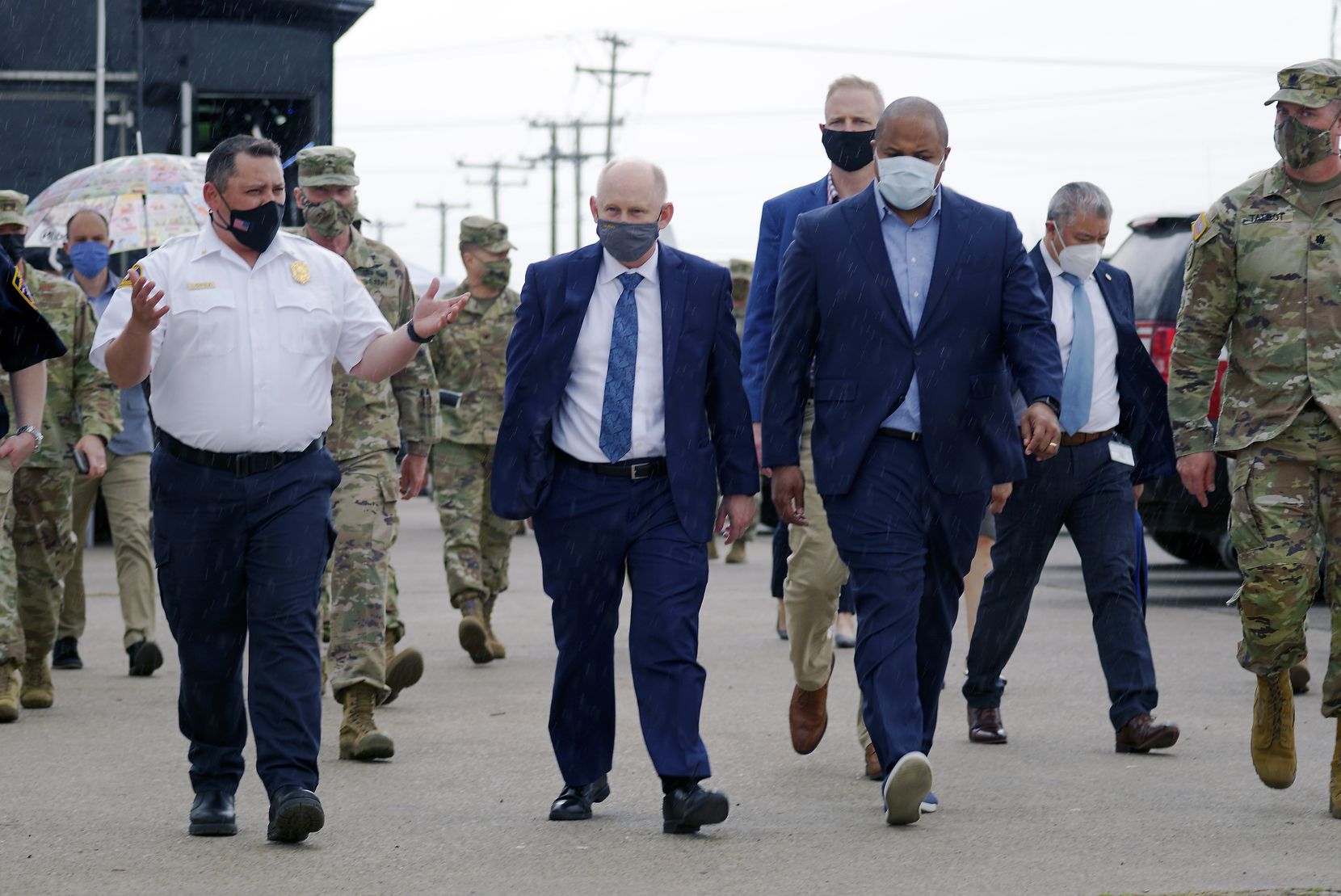 Dallas Mayor Eric Johnson (right) toured Dallas County's Community Vaccination Center at Fair Park in March with John Whitley (center), acting secretary of the Army, and Incident Commander Steve Lopez (left) of the Dallas Fire Department.