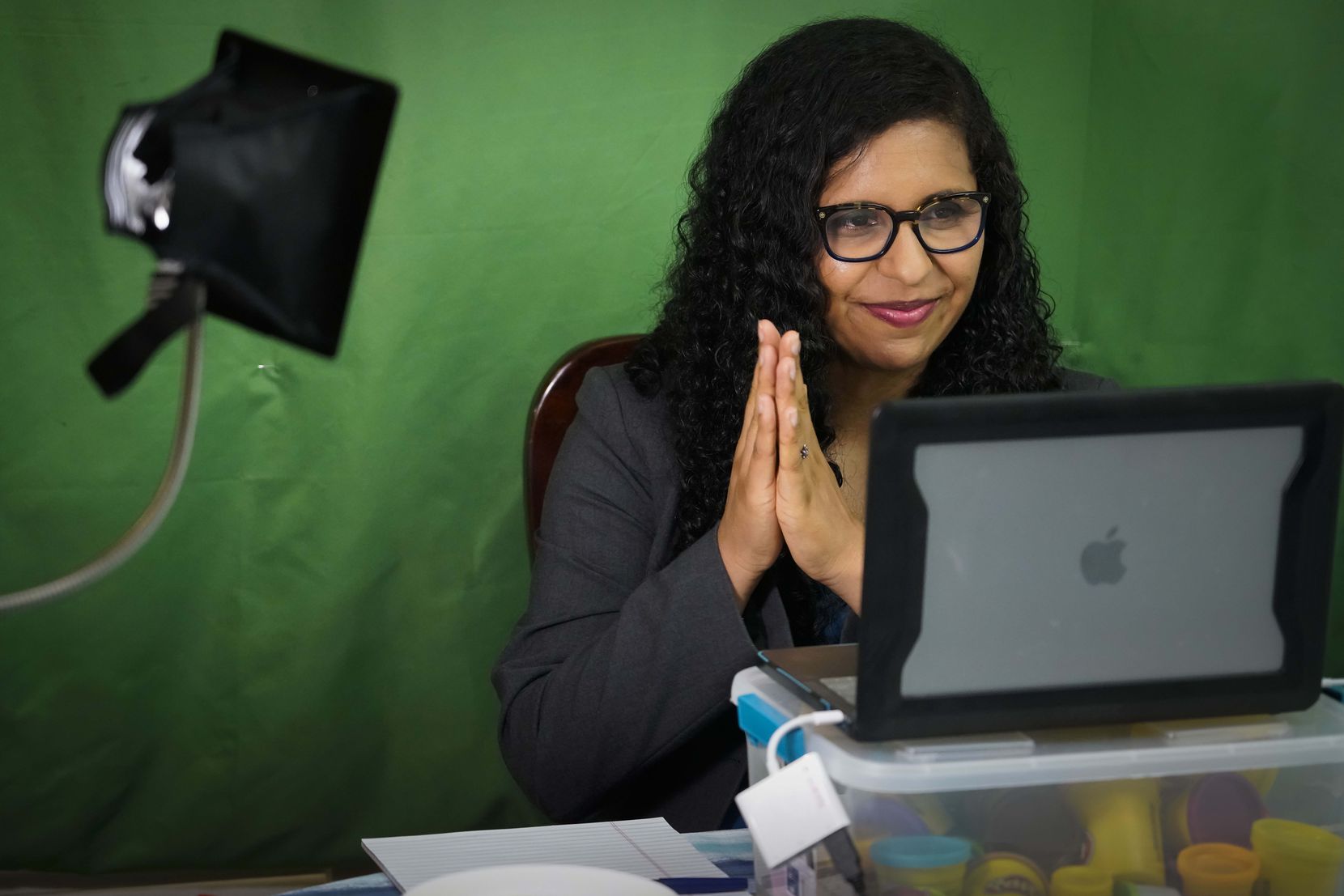 Candace Valenzuela holds a virtual fundraiser from her dining room table on Wednesday, June 24, 2020, in Dallas. (Smiley N. Pool/The Dallas Morning News)
