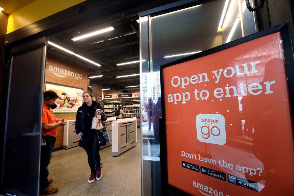A shopper leaves an Amazon Go store in Seattle. 