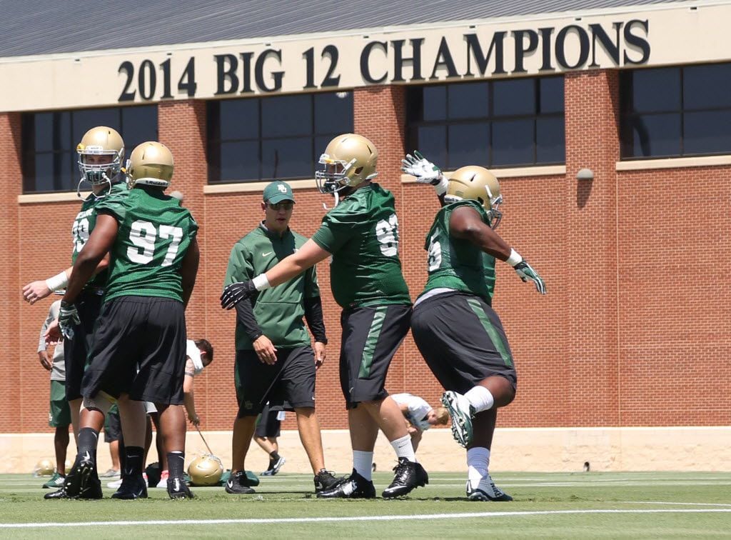 Baylor defensive players work out during the first day of practice for the 2015 season,...