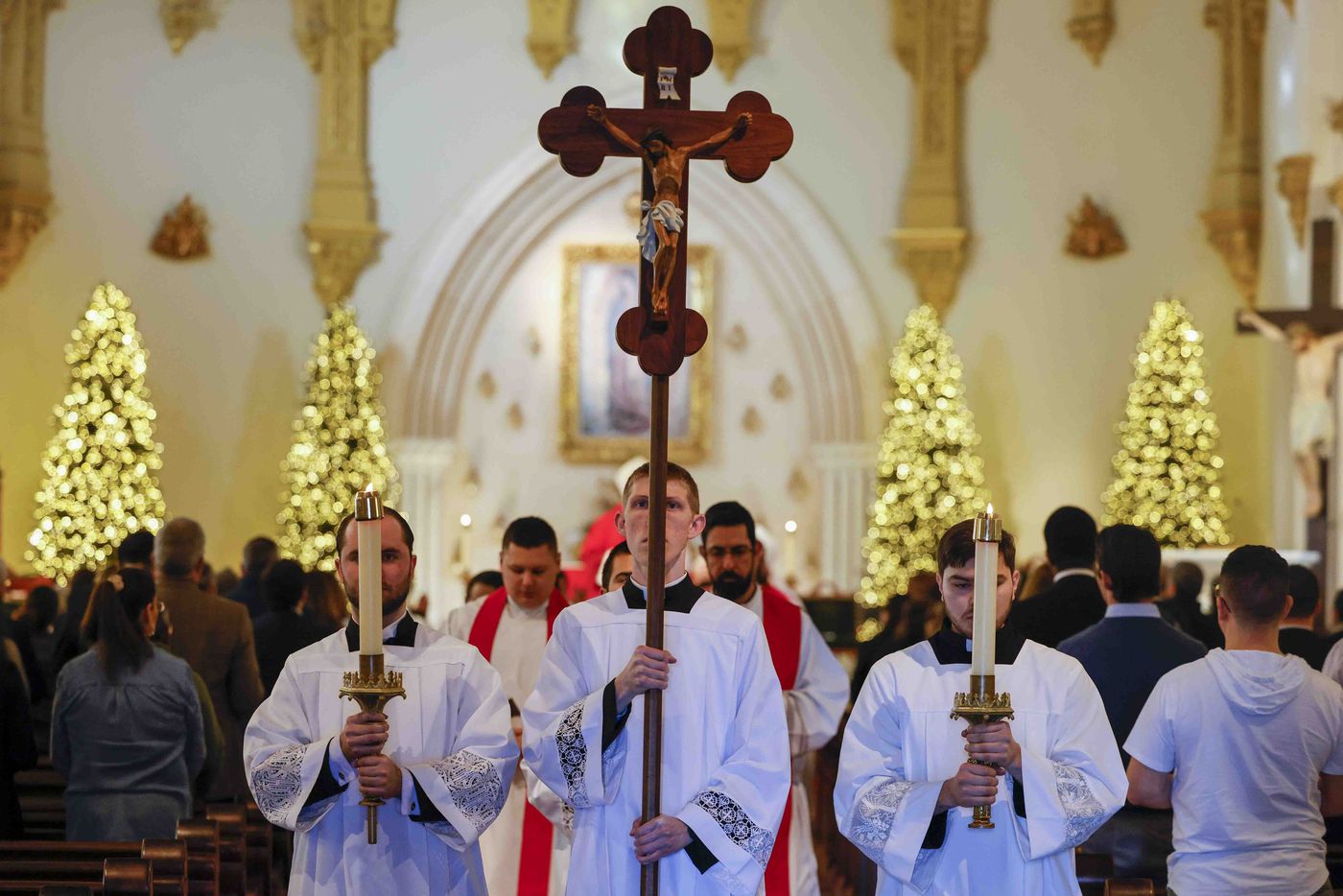 Seminarians process out of the church following a memorial mass for late Pope Emeritus...
