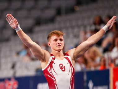 University of Oklahoma's Allan Bower sticks the vault during Day 1 of the US gymnastics...