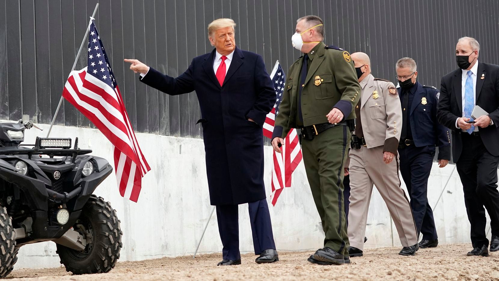 President Donald Trump tours a section of the U.S.-Mexico border wall under construction...