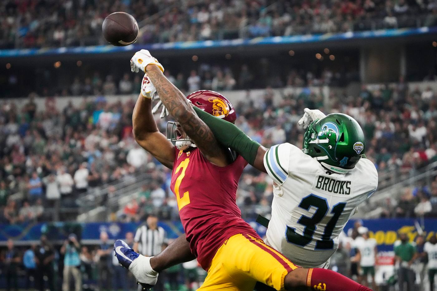 Tulane safety Larry Brooks (31) breaks up a pass intended for USC wide receiver Brenden Rice...