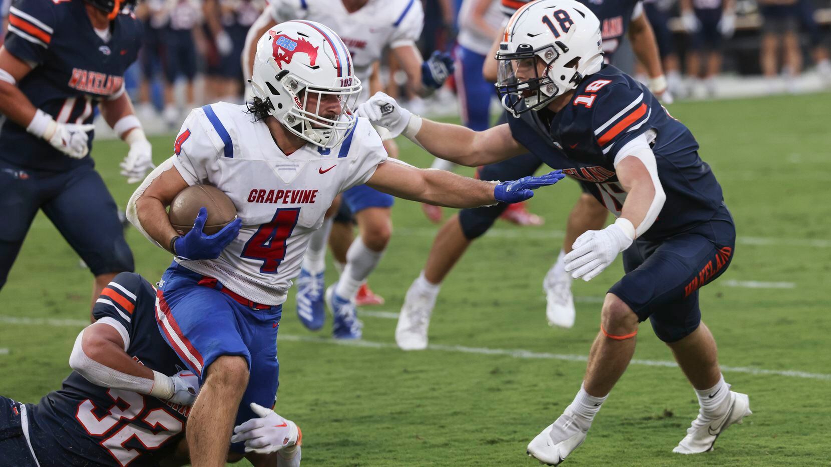 Grapevine High School’s Parker Polk (4) carries the ball up the field as Wakeland High...