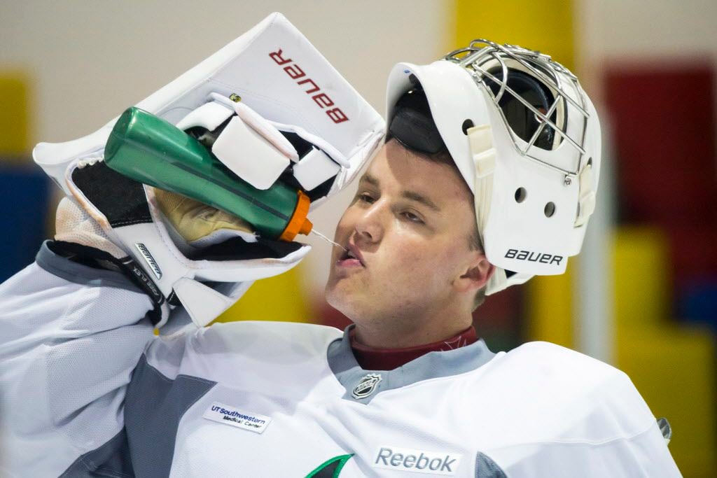 FILE - Goalie Jake Oettinger gets a drink of water between drills on the first day of Dallas...