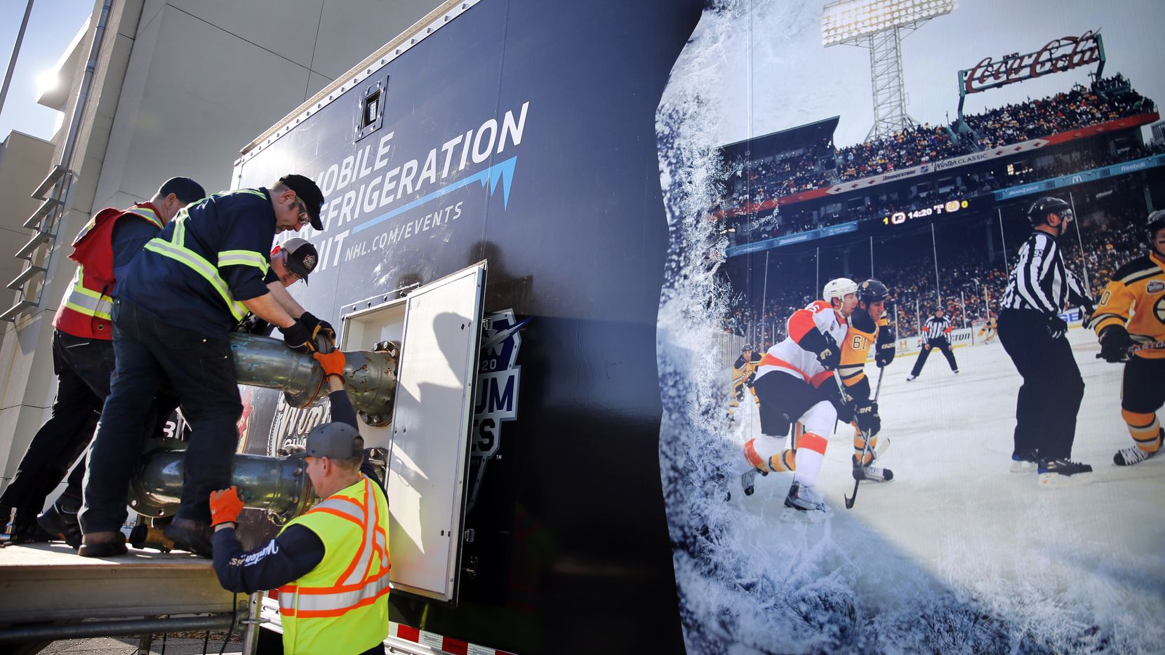 Workers assemble parts of the Mobile Refrigeration Unit which will freeze and keep the ice frozen for the New Year's Day Winter Classic hockey game at Fair Park in Dallas, Tuesday, December 17, 2019. According to the NHL, the 53-foot trailer is the world's largest mobile refrigeration unit. It houses a state-of-the-art ice-making and ice-monitoring equipment used to create an NHL-caliber sheet of ice. The annual game will pit the Dallas Stars against the Nashville Predators at the Cotton Bowl. (Tom Fox/The Dallas Morning News)