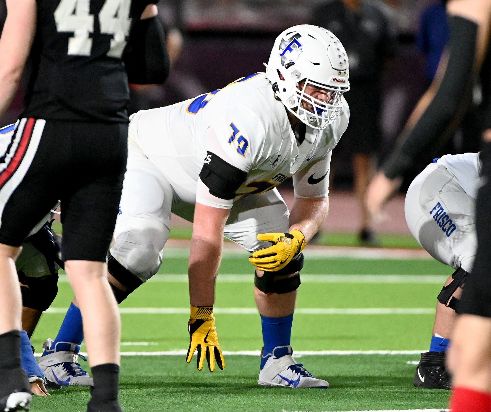 Frisco's Cole Hutson (70) readies for a play in the first half of a high school football...