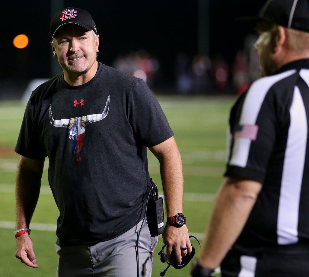 Cedar Hill head coach Joey McGuire argues with a referee during a high school football game...