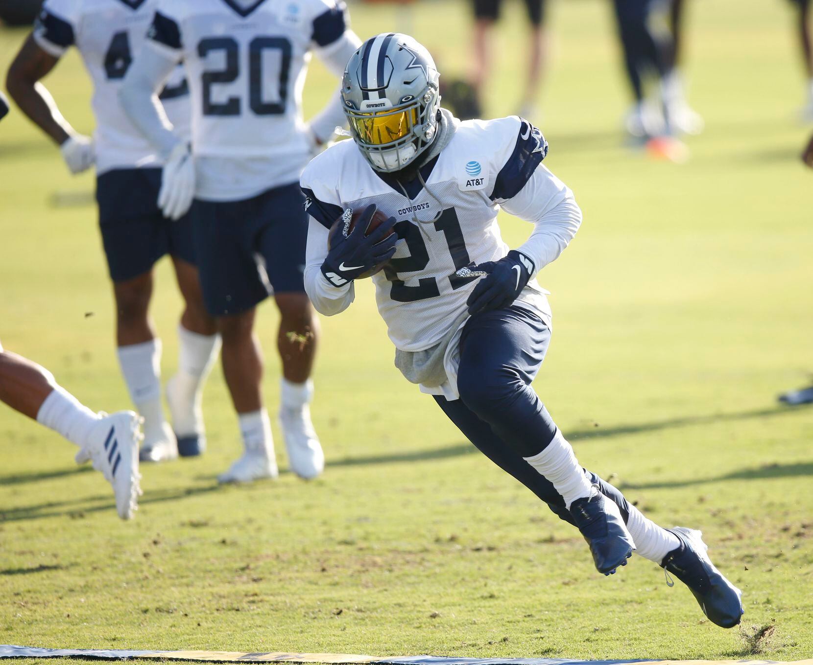 Dallas Cowboys running back Ezekiel Elliott (21) runs up the field on a play during the...