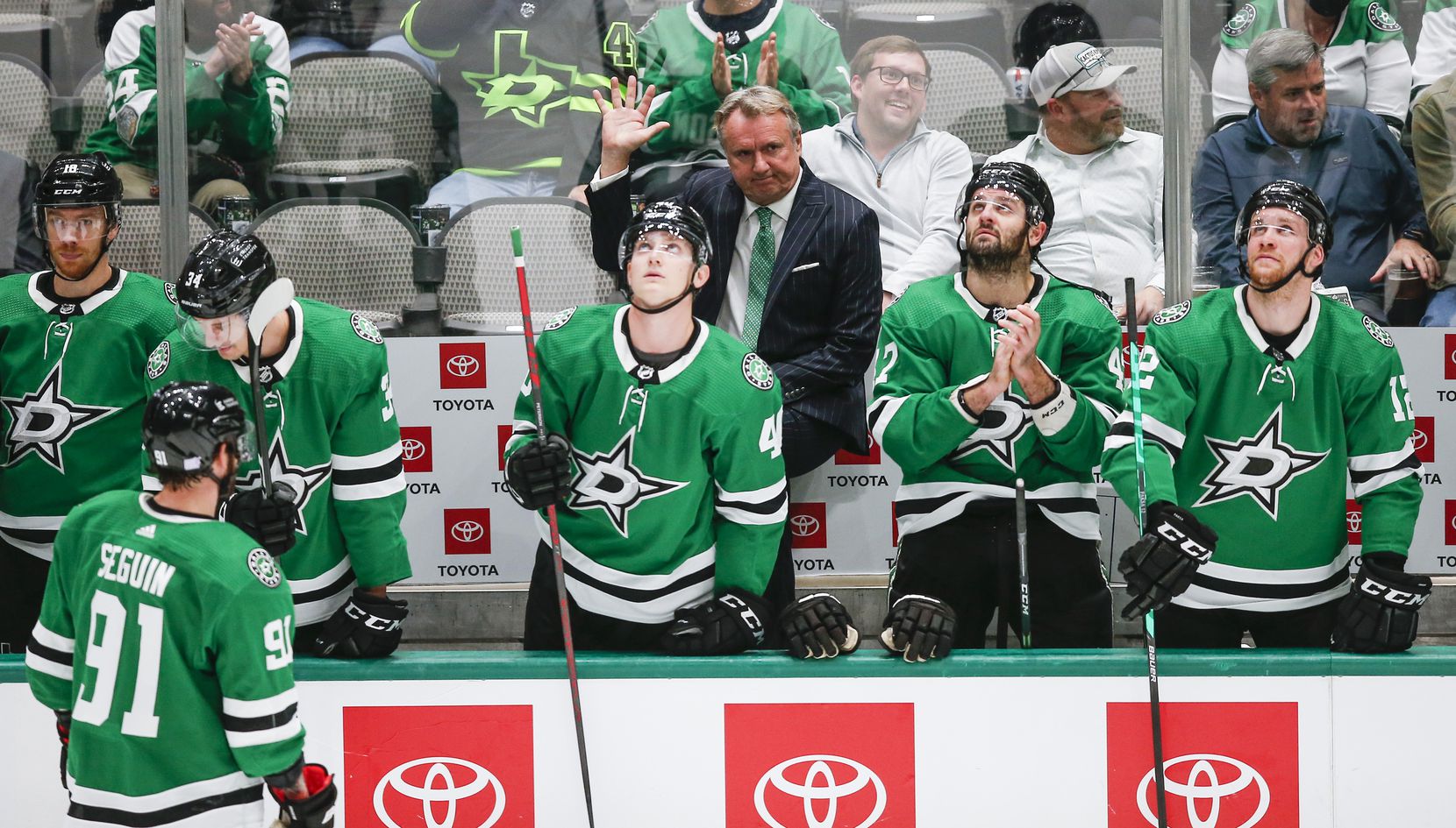Dallas Stars head coach Rick Bowness acknowledges fans after it was announced that it was his 2,500th career game as head or assistant coach in the NHL during the first period of a hockey game against the Carolina Hurricanes in Dallas, Tuesday, November 30, 2021. (Brandon Wade/Special Contributor)