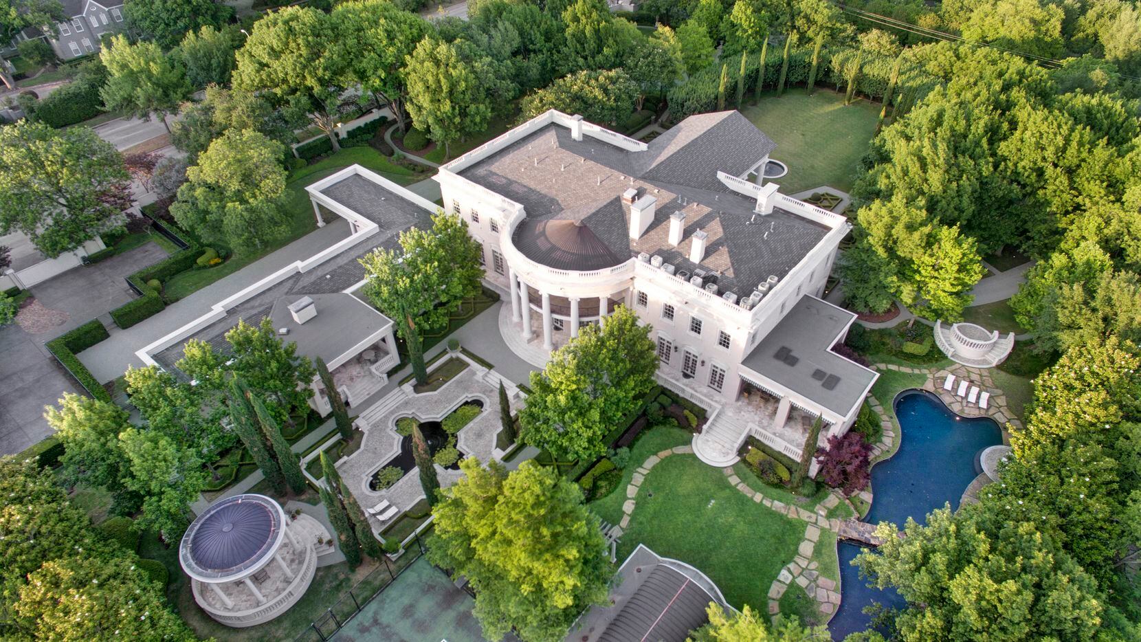 Called the White House of Dallas, the more than 16,000-square-foot Strait Lane home has nine...