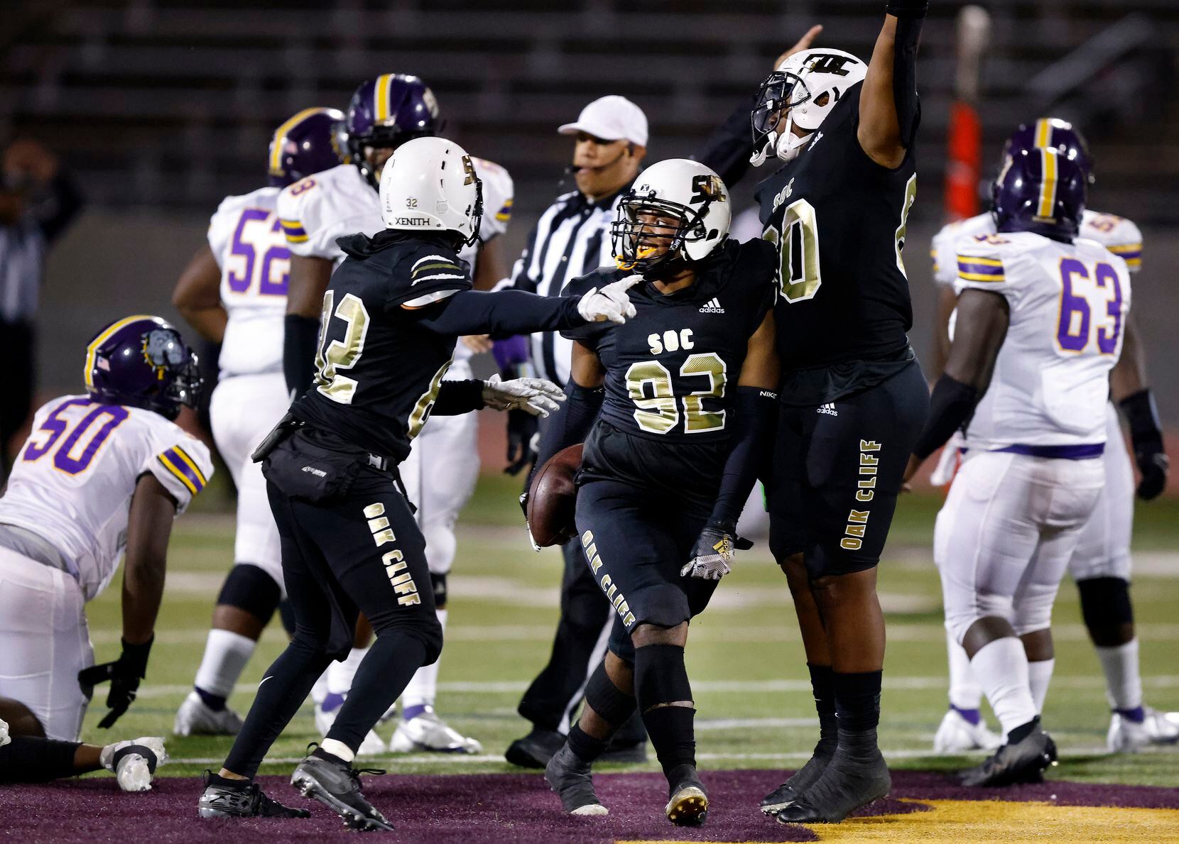 South Oak Cliff defensive lineman Tyson Owens (92) comes up with a fourth quarter fumble...
