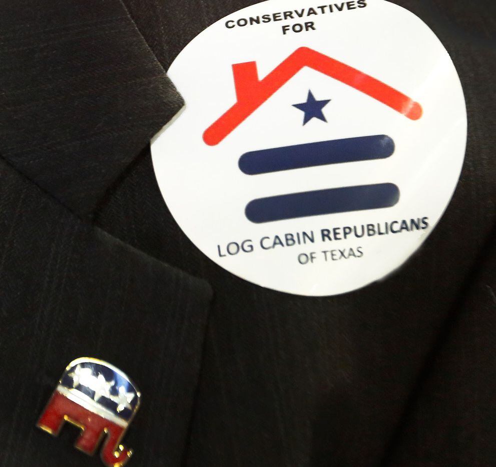 A delegate wears a sticker representing the Log Cabin Republicans, as seen during the 2018...