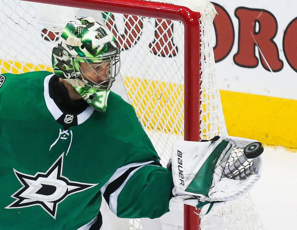 Dallas Stars goaltender Ben Bishop (30) blocks a Minnesota Wild shot on goal during the third period of a match between the Dallas Stars and the Minnesota Wild on Friday, Feb. 1, 2019 at the American Airlines Center in Dallas. (Ryan Michalesko/The Dallas Morning News)
