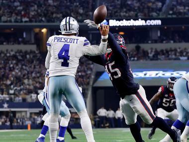 Houston Texans linebacker Ogbonnia Okoronkwo (45) knocks a pass from Dallas Cowboys...