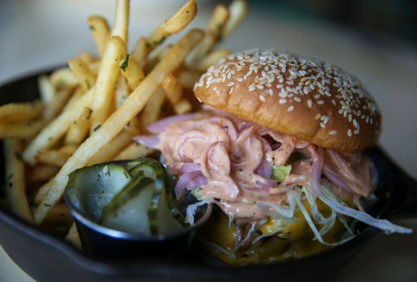 One of the most popular menu items at Punch Bowl Social is the Knockoff Burger, made with...