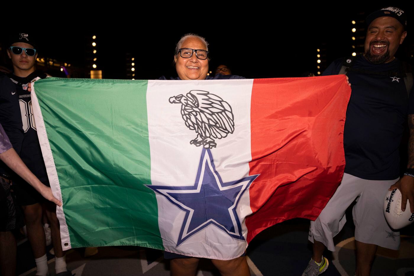 Dallas Cowboys fan Virginia Castanuela from Midlothian holds a custom flag while waiting for...