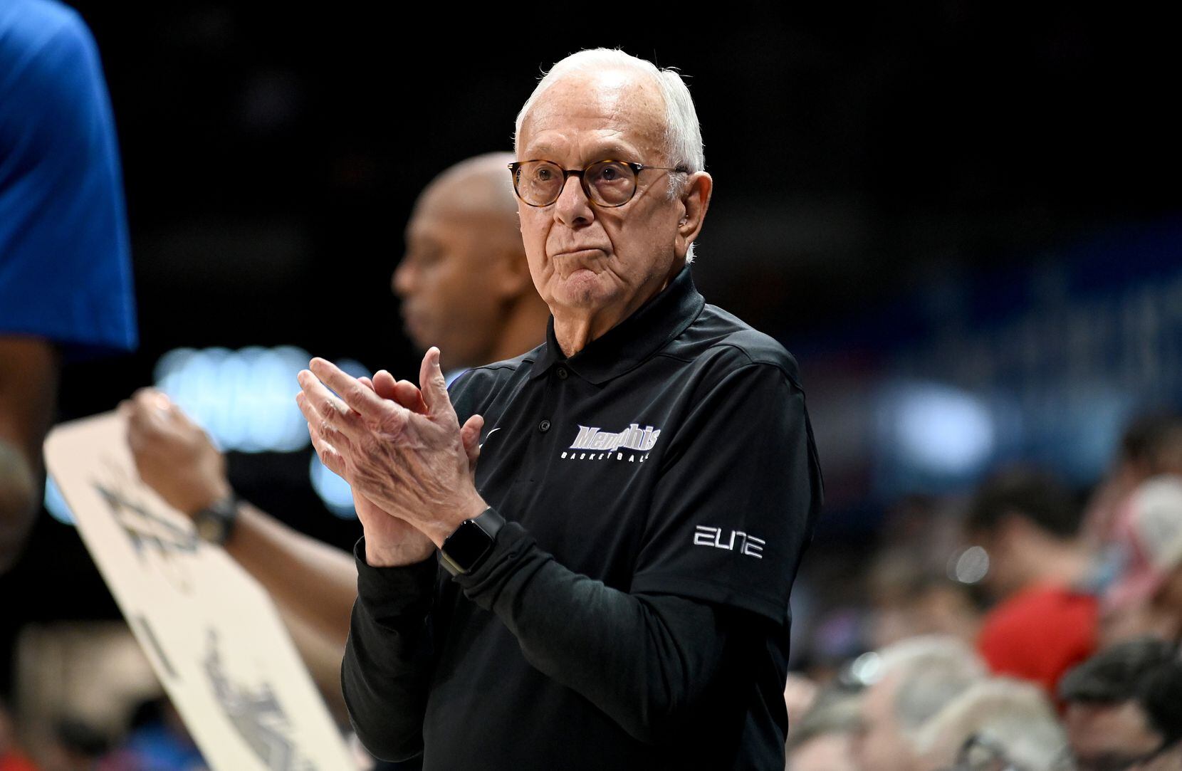 Former SMU head coach and current Memphis assistant coach Larry Brown cheers on his team in...