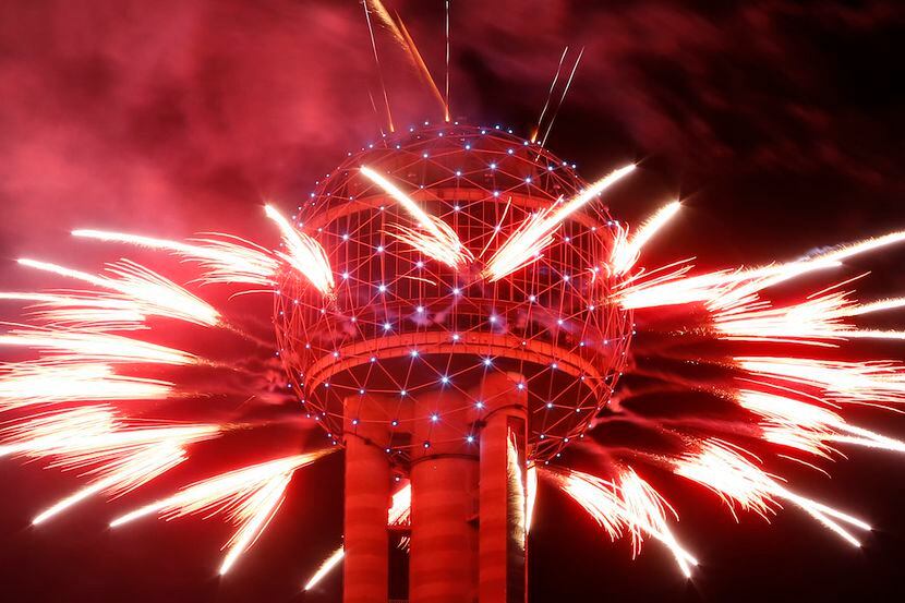 Fireworks fly from Reunion Tower during the New Year's Eve event.