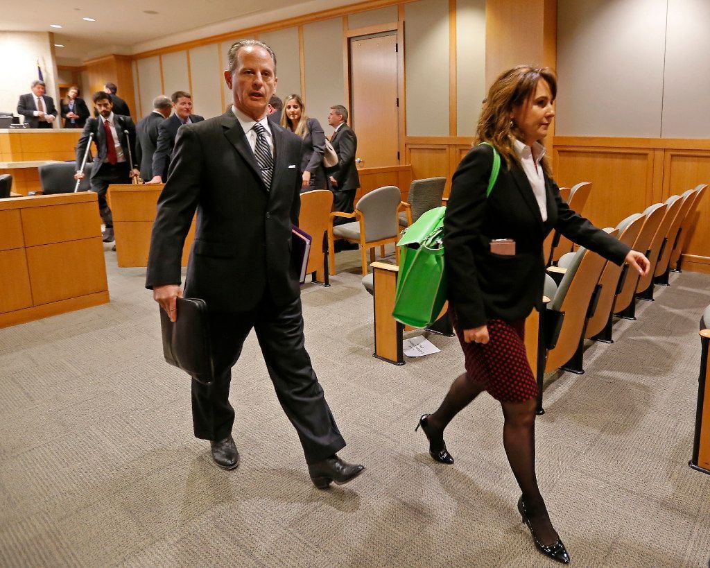 Special prosecutors Brian Wice (left) and Nicole DeBorde leave a courtroom after a Texas...
