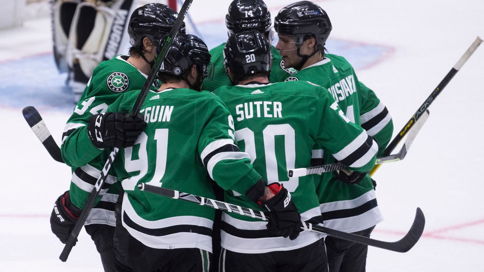 Players celebrate Dallas Stars center Tyler Seguin’s (91) score during the first period of a...