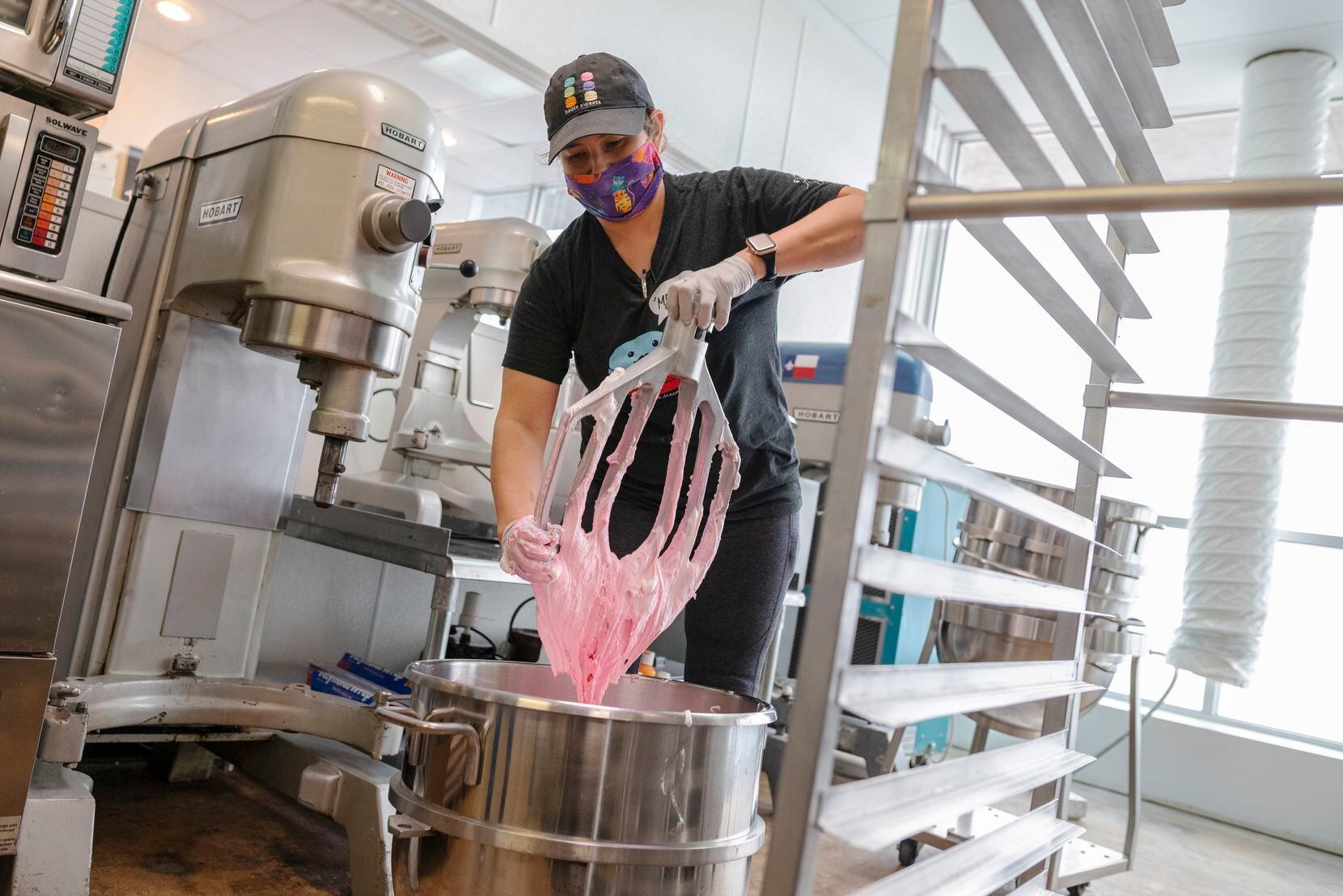 Owner and pastry chef Tida Pichakron mixes macaron batter in her kitchen at Haute Sweets Patisserie in Dallas.