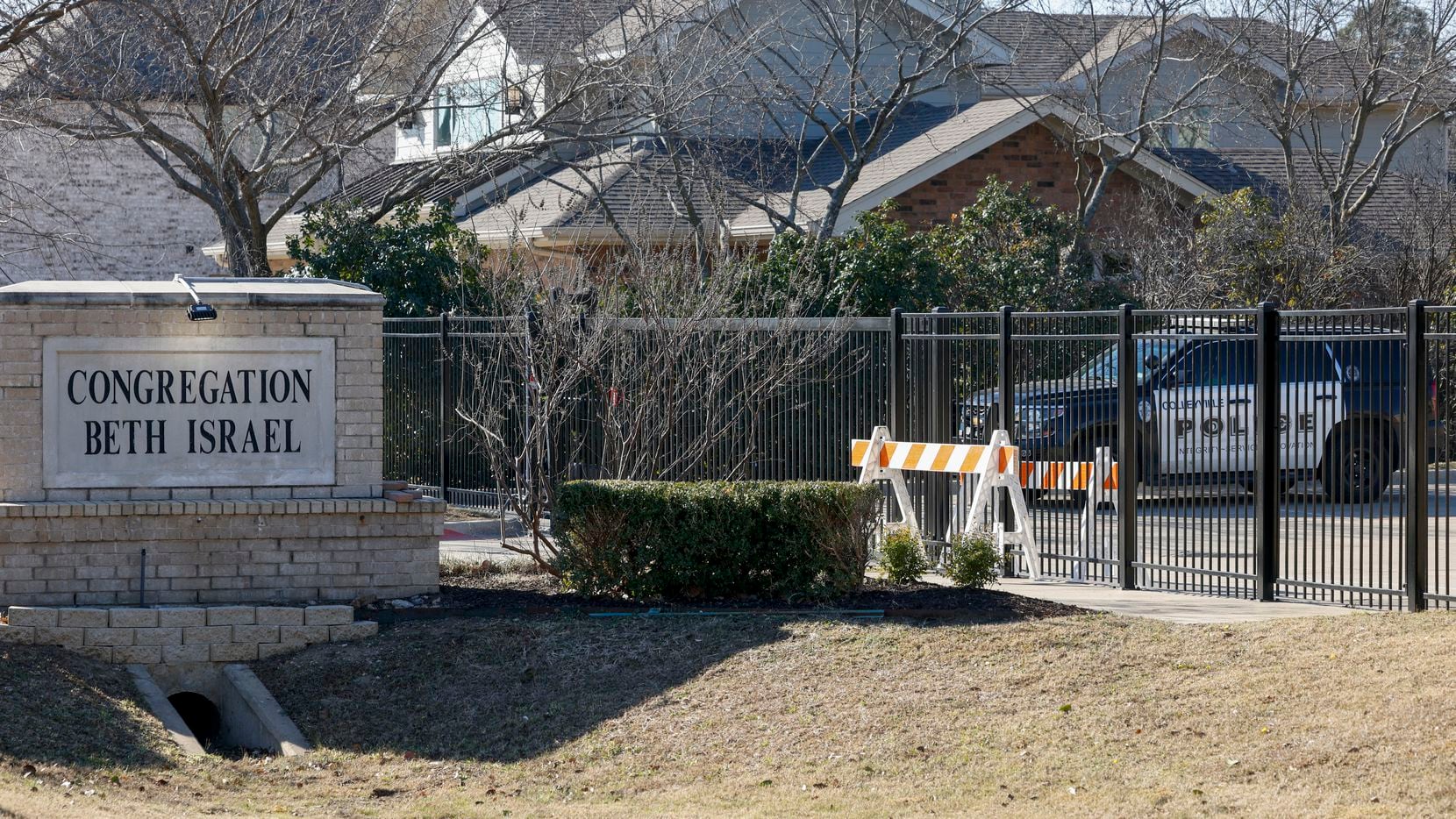 A Colleyville police officer guards the entrance to Congregation Beth Israel on Jan. 22,...