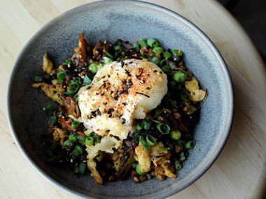 Fried sorghum with oyster mushrooms, Napa cabbage, spring peas, tempura farm egg, and...