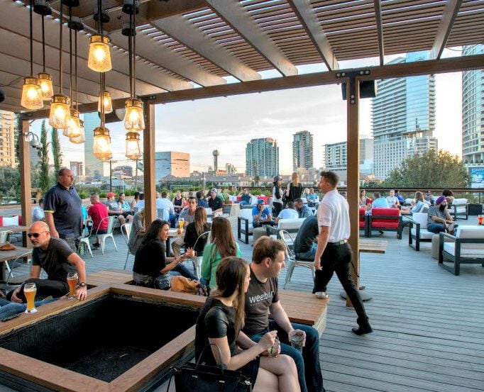 The terrace-level deck at the Happiest Hour restaurant and bar in the Harwood District. 