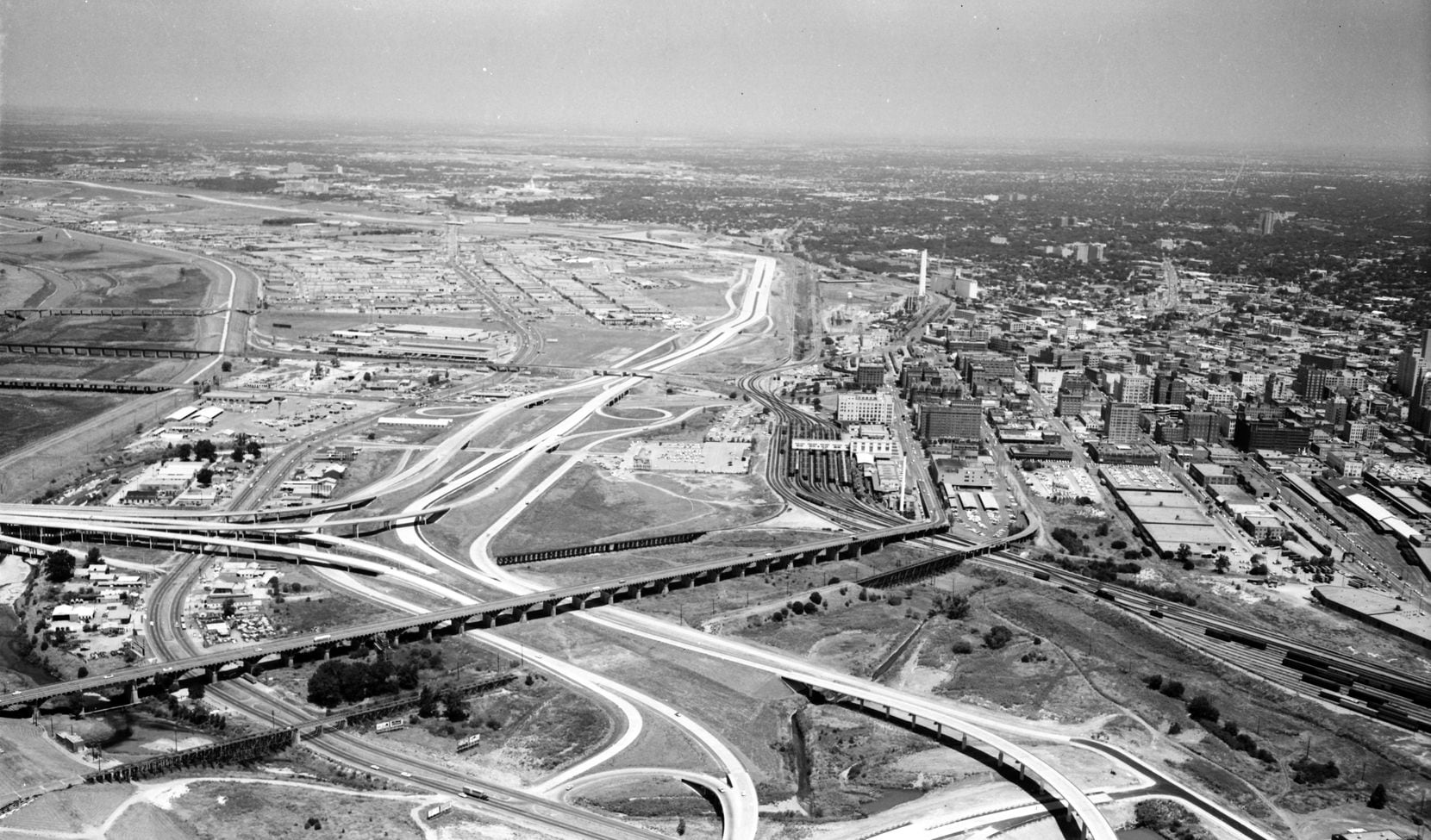 Construction of Stemmons Freeway, which started in the 1950s, sent office development...