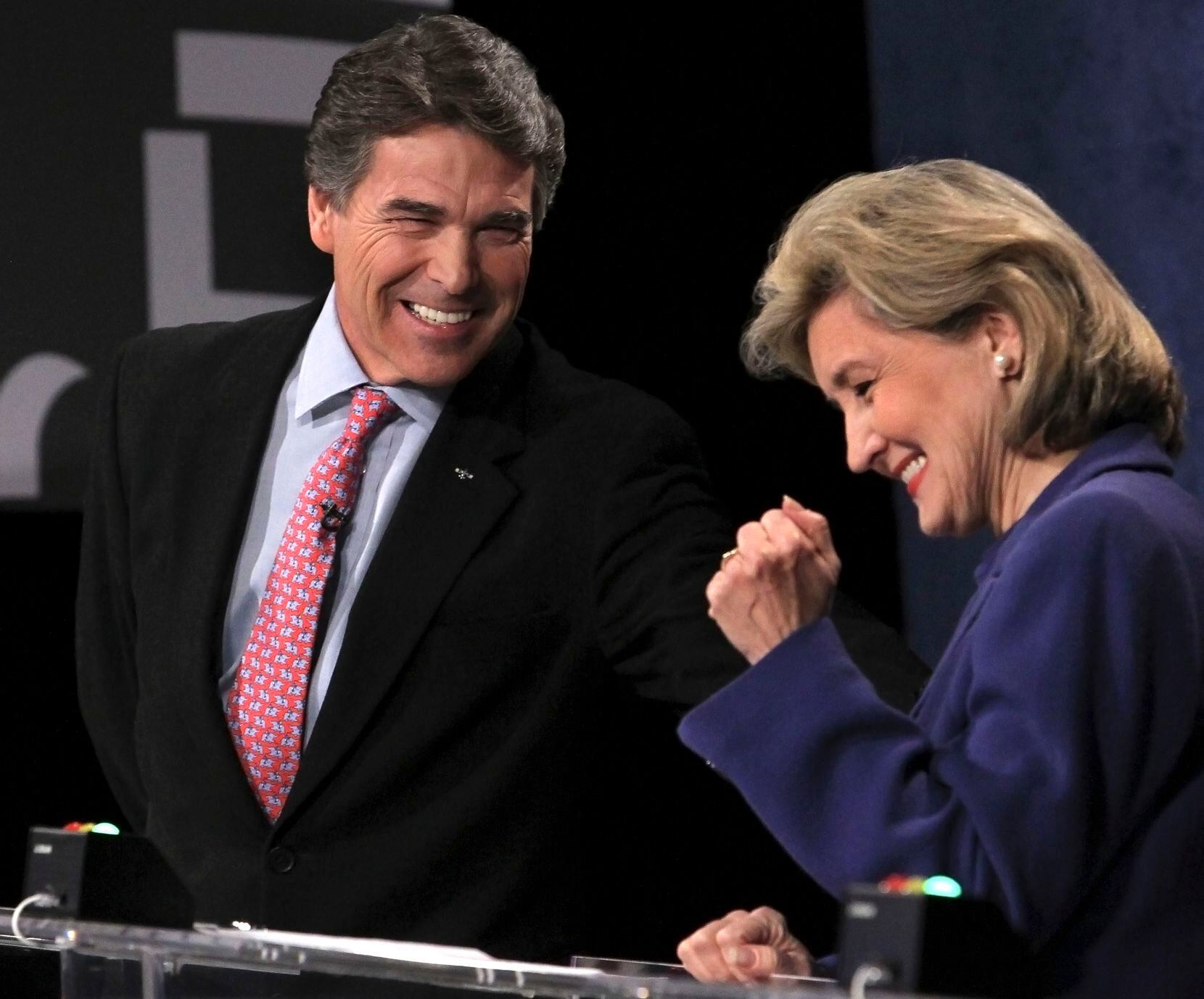 Texas Gov. Rick Perry and Sen. Kay Bailey Hutchison, R-Texas, shared a light moment during...