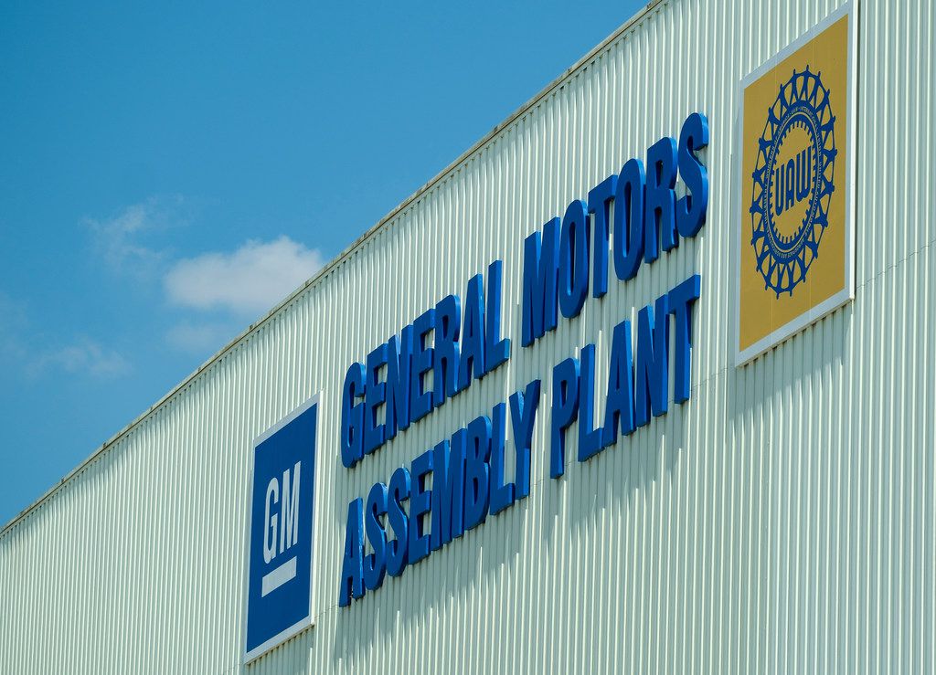 GM and UAW signs on the exterior of the General Motors assembly plant in Arlington.