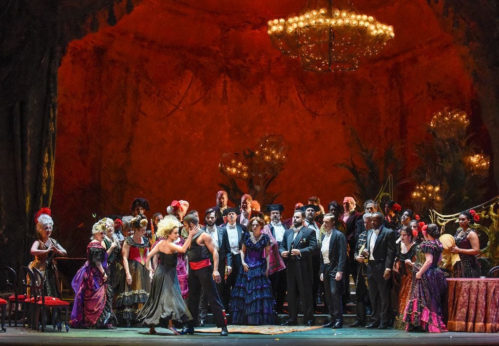 Dancers entertain a party crowd in the Dallas Opera's La traviata. (Karen Almond/Dallas Opera)
