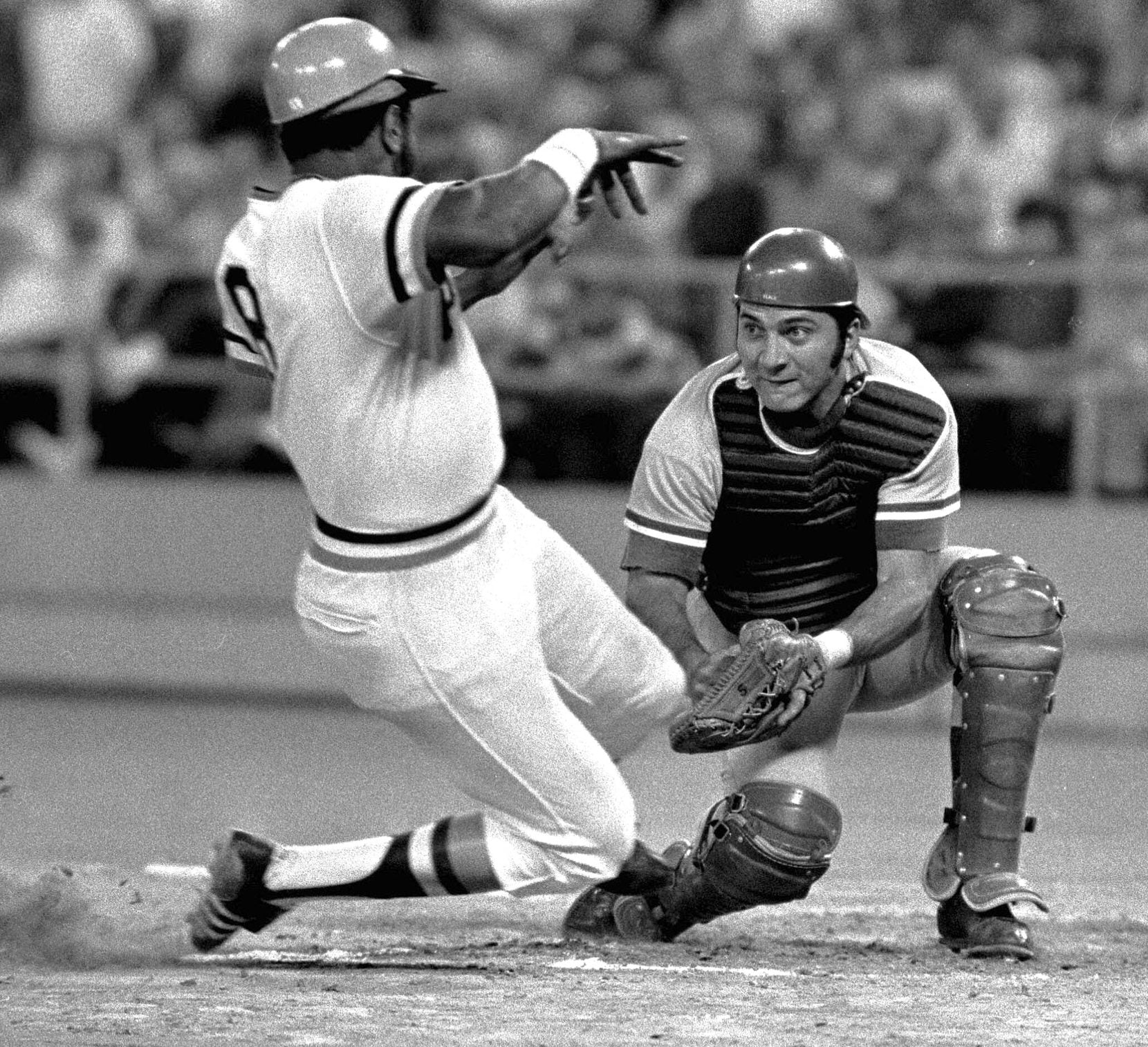 Pittsburgh Pirates' left fielder Willie Stargell, left, is tagged out by Cincinnati Reds...