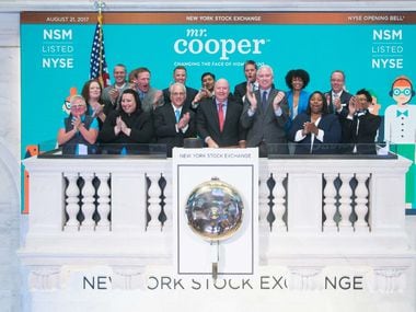 Jay Bray (center), chairman and CEO of Nationstar, and other company executives after ringing the opening bell at NYSE on Aug. 21, 2017.