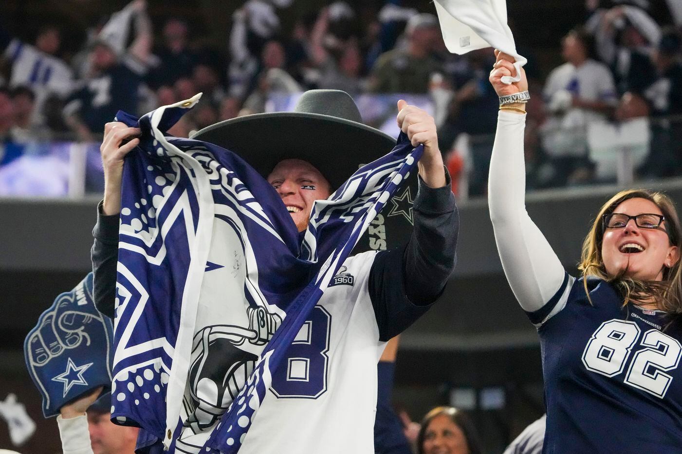 Dallas Cowboys fans cheer a defensive stop during the second quarter of an NFL football game...