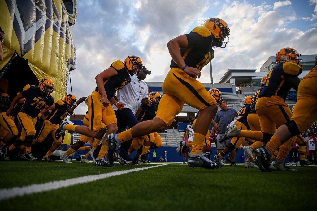 McKinney takes the field for their game against Plano high school on Thursday, October 10,...