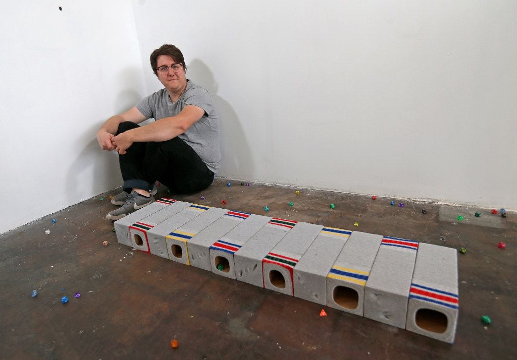 Artist Shelby David Meier poses for a photograph with his sculpture called "Nothing feels...