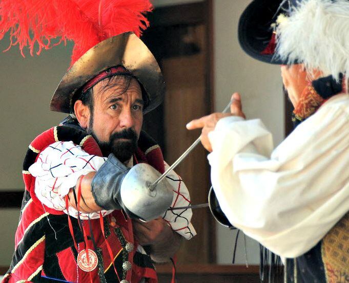 Sword fighting comedians provide medieval entertainment at Scarborough Renaissance Festival.