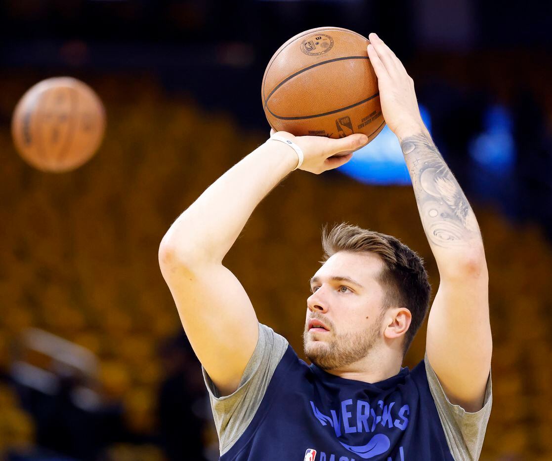 Dallas Mavericks guard Luka Doncic warms up before facing the Golden State Warriors in Game...