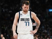 Dallas Mavericks' Luka Doncic reacts during his team's loss to the Toronto Raptors in NBA...