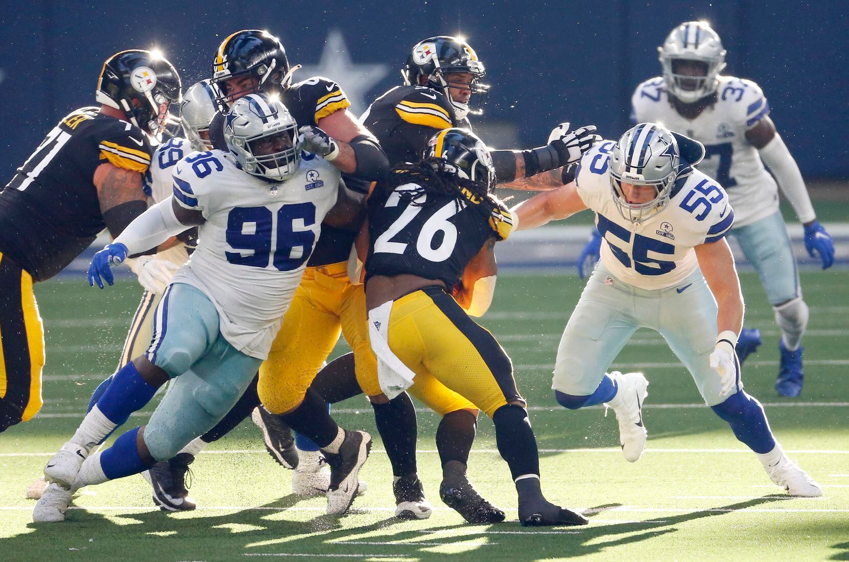 Dallas Cowboys defensive tackle Neville Gallimore (96) and Dallas Cowboys outside linebacker Leighton Vander Esch (55) stop a run attempt from Pittsburgh Steelers running back Anthony McFarland (26) during the second quarter of play at AT&T Stadium in Arlington, Texas on Sunday, November 8, 2020. (Vernon Bryant/The Dallas Morning News)