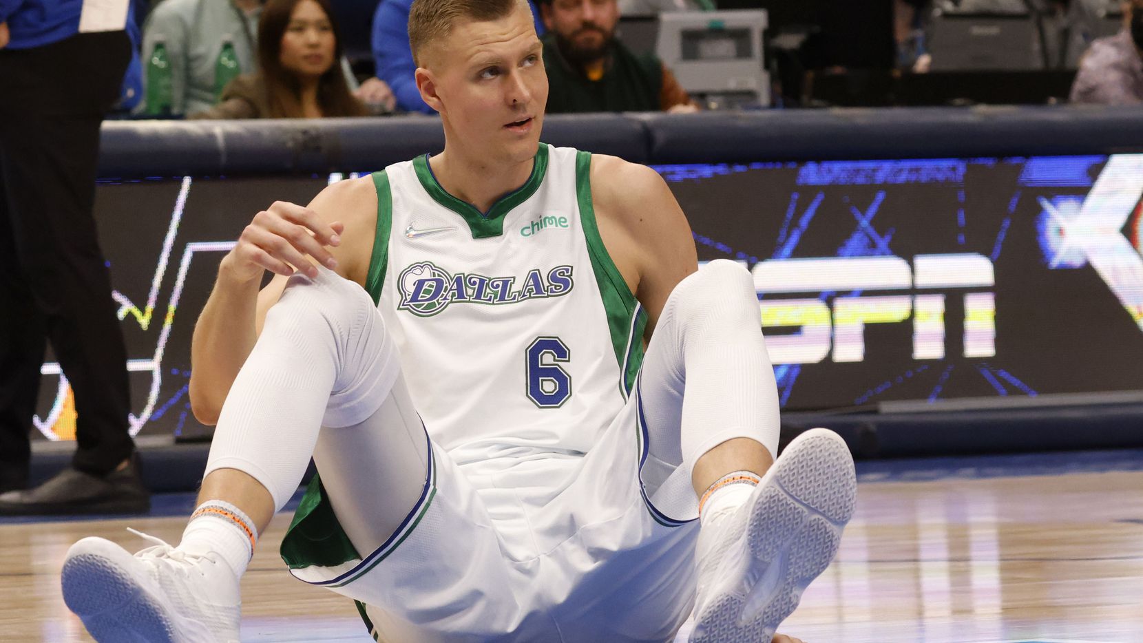 Dallas Mavericks center Kristaps Porzingis (6) gathers himself before getting up in a game against the Los Angeles Lakers during the first half of play at American Airlines Center, on Wednesday, December 15, 2021, in Dallas.