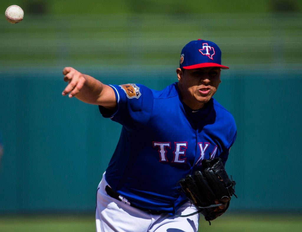 Texas Rangers starting pitcher Ariel Jurado (74) pitches during the fifth inning of a spring...